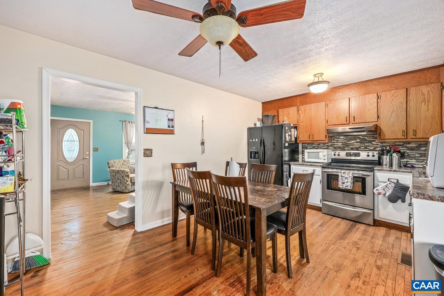 63 Ox Road Waynesboro, VA 22980 - Photo 8 of 25 a view of a dining room with furniture window and wooden floor