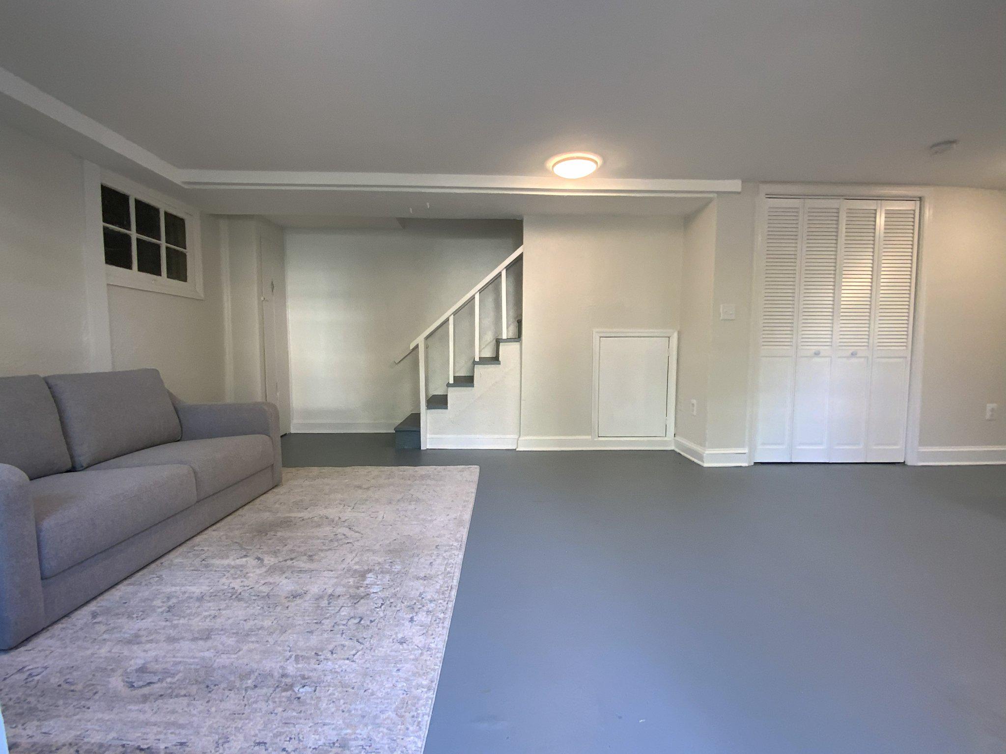 1772 E Street Northeast Washington, DC 20002 - Photo 17 of 23 a living room with furniture and a ceiling fan