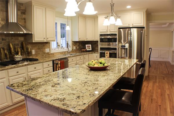 440 Great Road Bedford, MA 01730 - Photo 4 of 23 a kitchen with stainless steel appliances granite countertop a sink a stove and a wooden floors