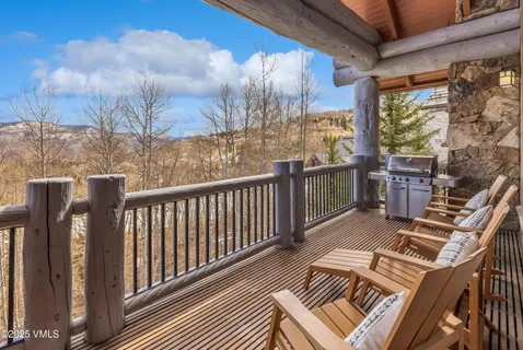 a view of balcony with wooden floor and outdoor seating