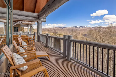 a view of a balcony with furniture