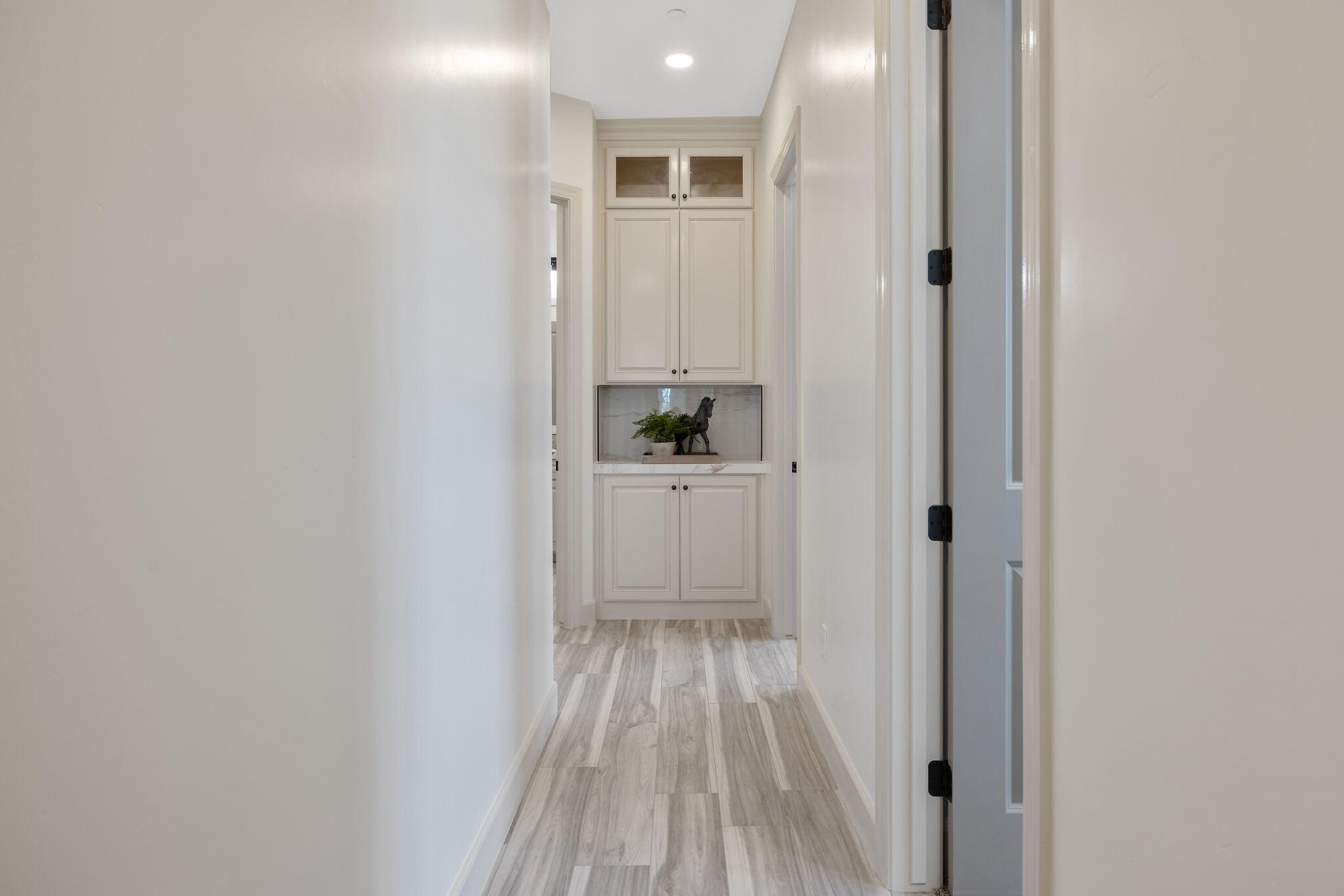 503 East Palm Street Exeter, CA 93221 - Photo 55 of 92 a view of a hallway with wooden floor and closet