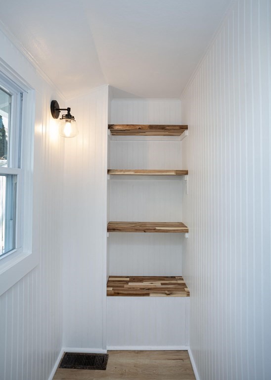 127 Pinehurst Drive Wareham, MA 02571 - Photo 28 of 40 a view of walk in closet with empty racks