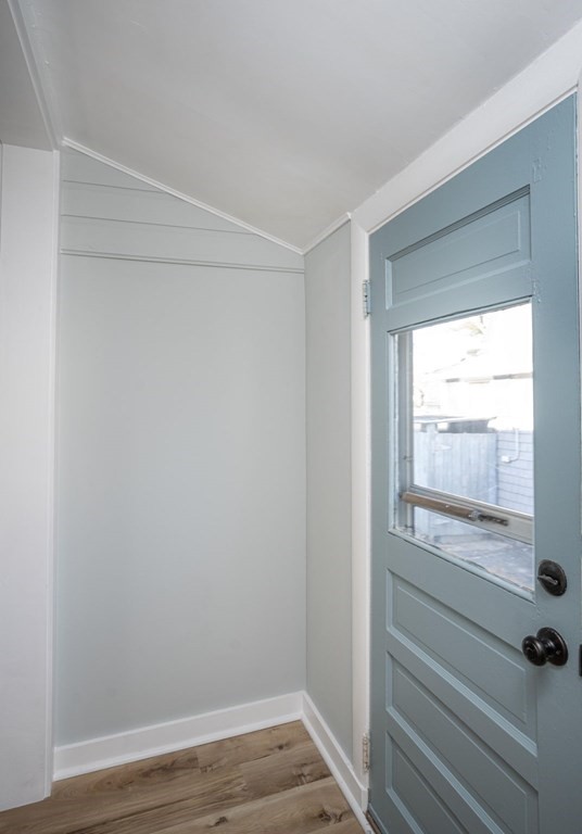 127 Pinehurst Drive Wareham, MA 02571 - Photo 29 of 40 a view of an empty room with wooden floor and a window