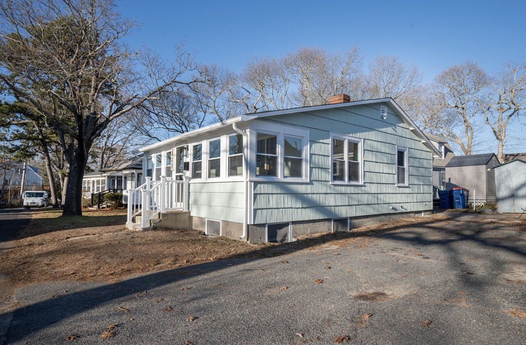 127 Pinehurst Drive Wareham, MA 02571 - Photo 3 of 40 a front view of a house with a yard