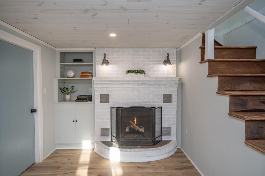 127 Pinehurst Drive Wareham, MA 02571 - Photo 36 of 40 a living room with furniture and a fireplace