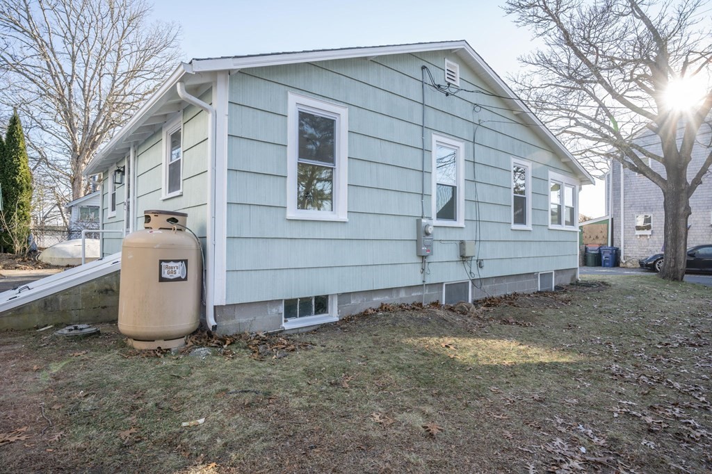 127 Pinehurst Drive Wareham, MA 02571 - Photo 5 of 40 a view of a house with a yard and garage