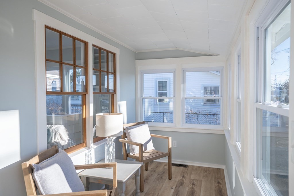 127 Pinehurst Drive Wareham, MA 02571 - Photo 7 of 40 a view of a dining room with furniture window and wooden floor