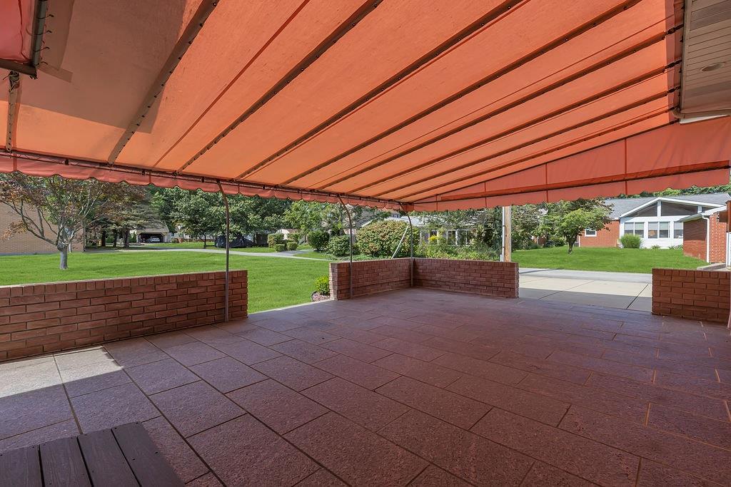 1750 River Road Beaver, PA 15009 - Photo 28 of 49 This covered veranda offers such a beautiful view of the side yard to the Ohio River nature scenes.