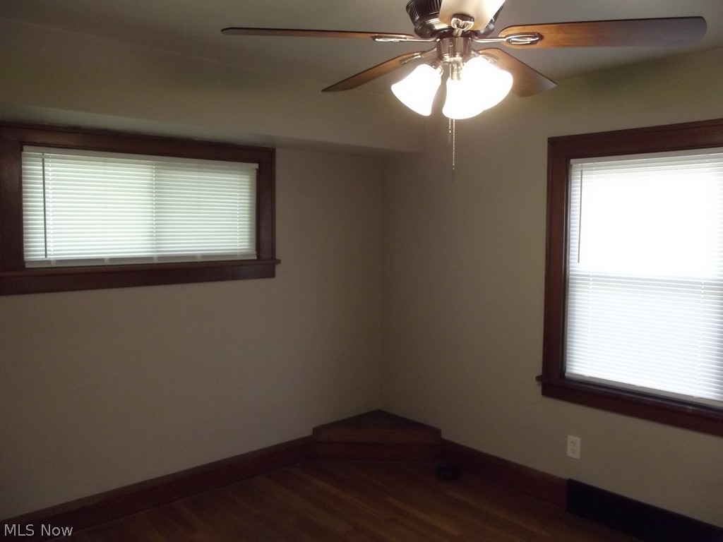 3363 Berea Road Cleveland, OH 44111 - Photo 19 of 50 Unfurnished room with dark hardwood / wood-style flooring and ceiling fan