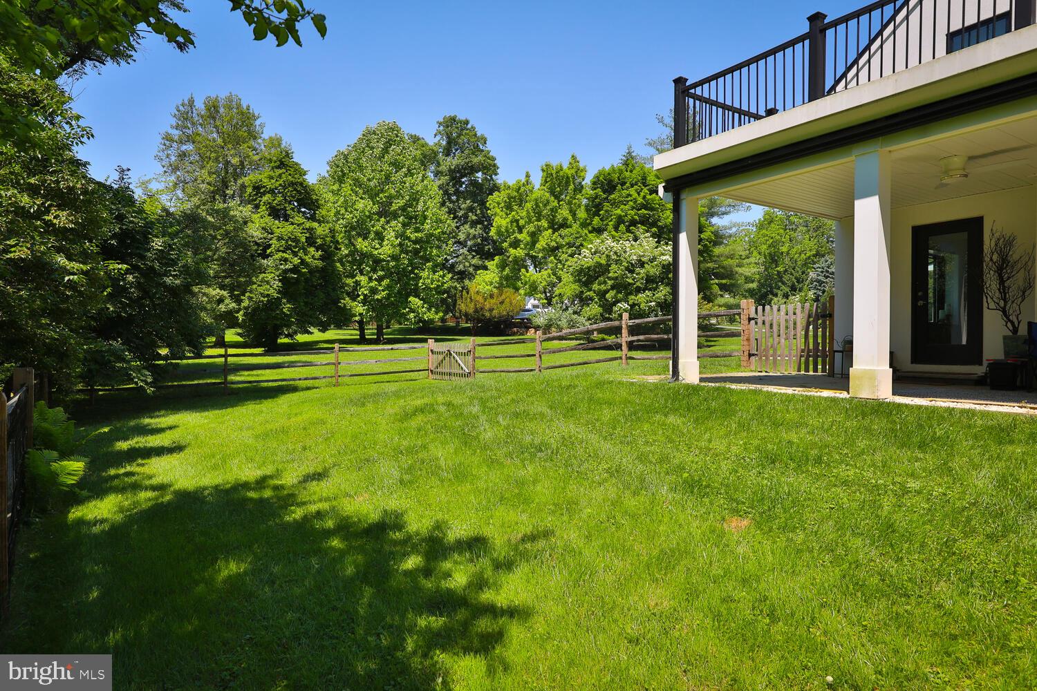 401 East Mill Road Flourtown, PA 19031 - Photo 14 of 33 Dog run and patio w/ ceiling fans off living room