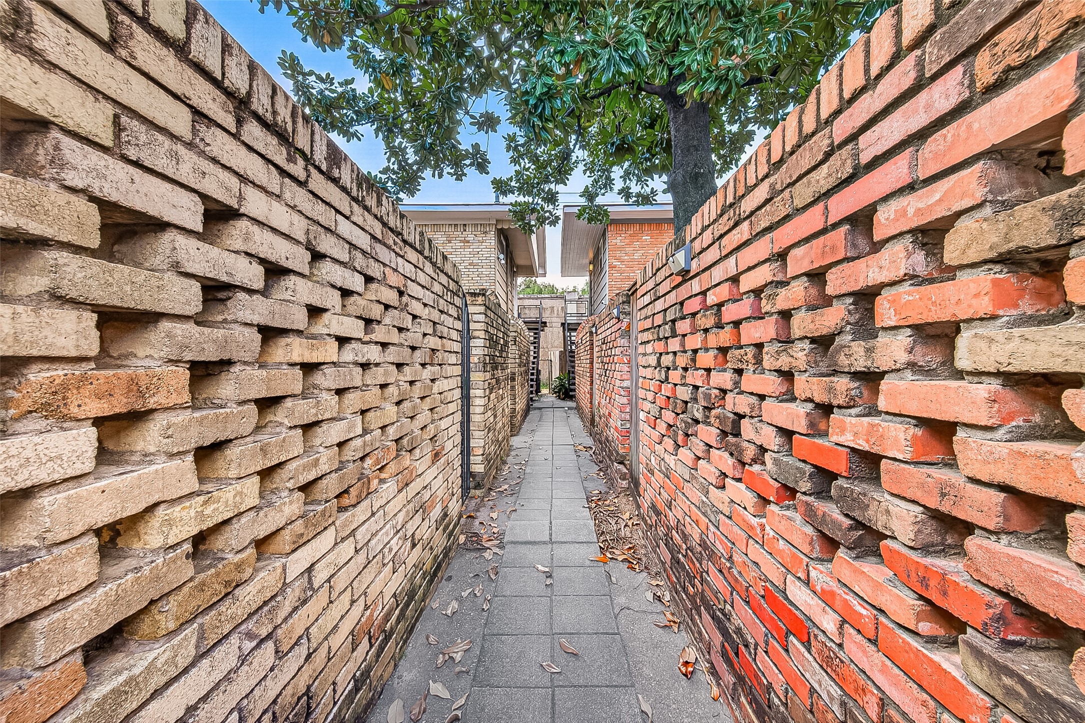 4727 Merwin Street, Unit A Houston, TX 77027 - Photo 12 of 45 The walkway to Unit A located behind the gated entrance!