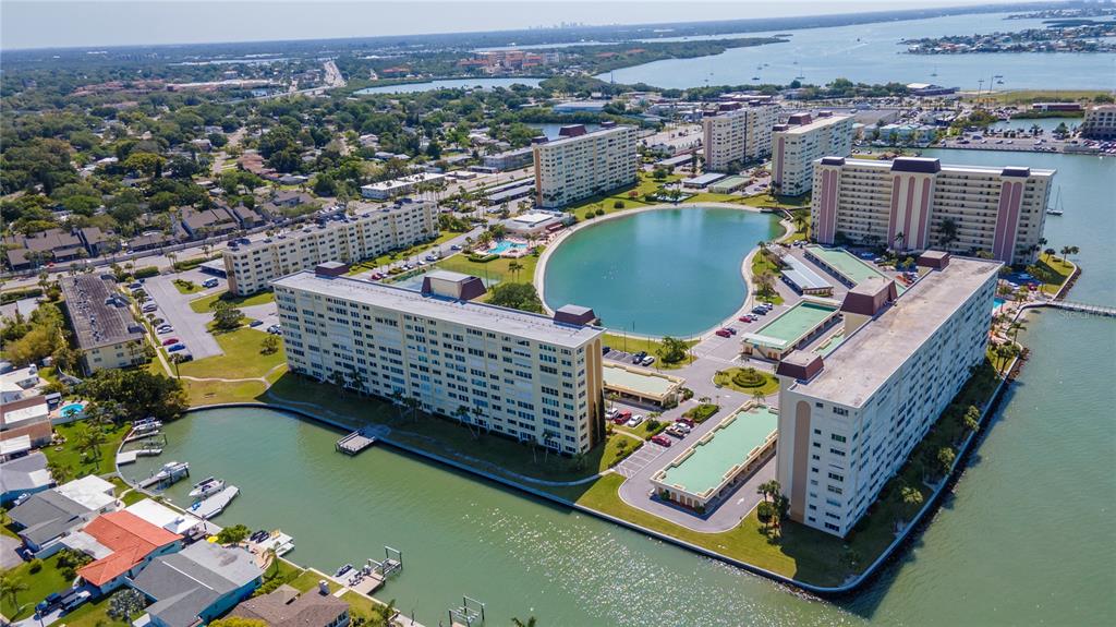 4525 Cove Circle, Unit 608 St. Petersburg, FL 33708 - Photo 1 of 1 an aerial view of a chairs and table on the deck
