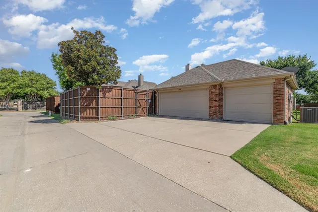 a view of backyard and garage