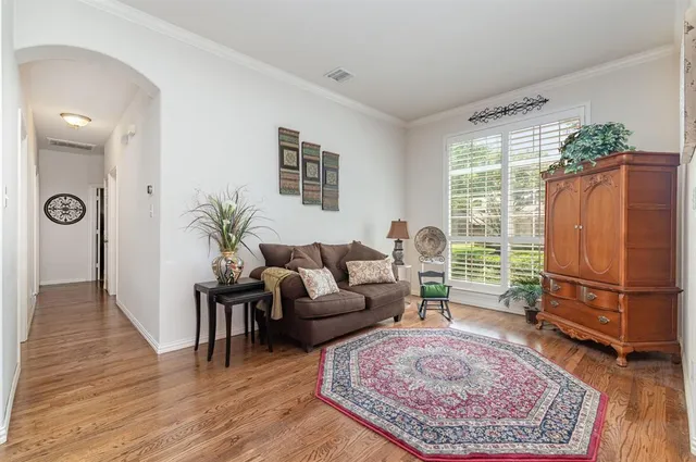 a living room with furniture and a rug