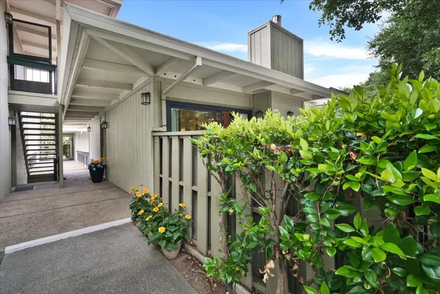 a front view of a house with lots of green space
