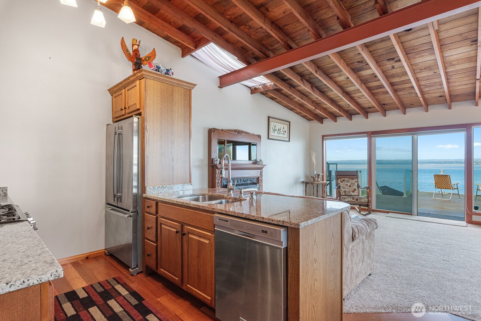 19422 Soundview Drive Northwest Stanwood, WA 98292 - Photo 11 of 33 a kitchen with sink refrigerator and microwave
