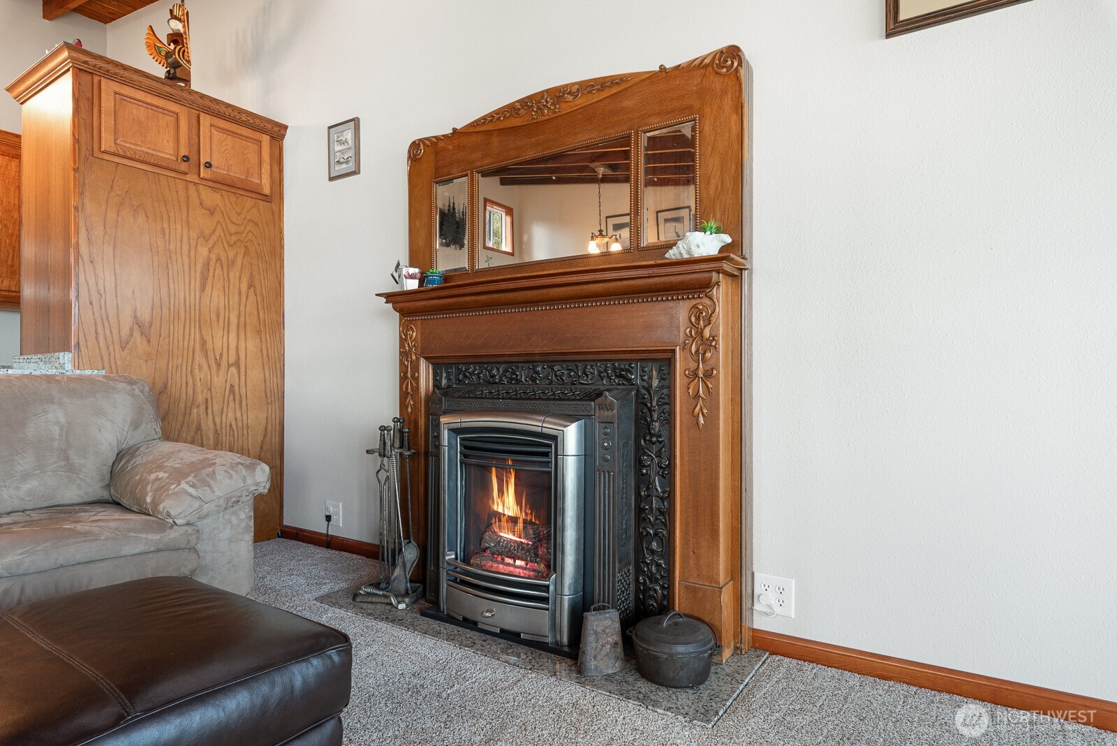 19422 Soundview Drive Northwest Stanwood, WA 98292 - Photo 16 of 33 a living room with furniture and a fireplace