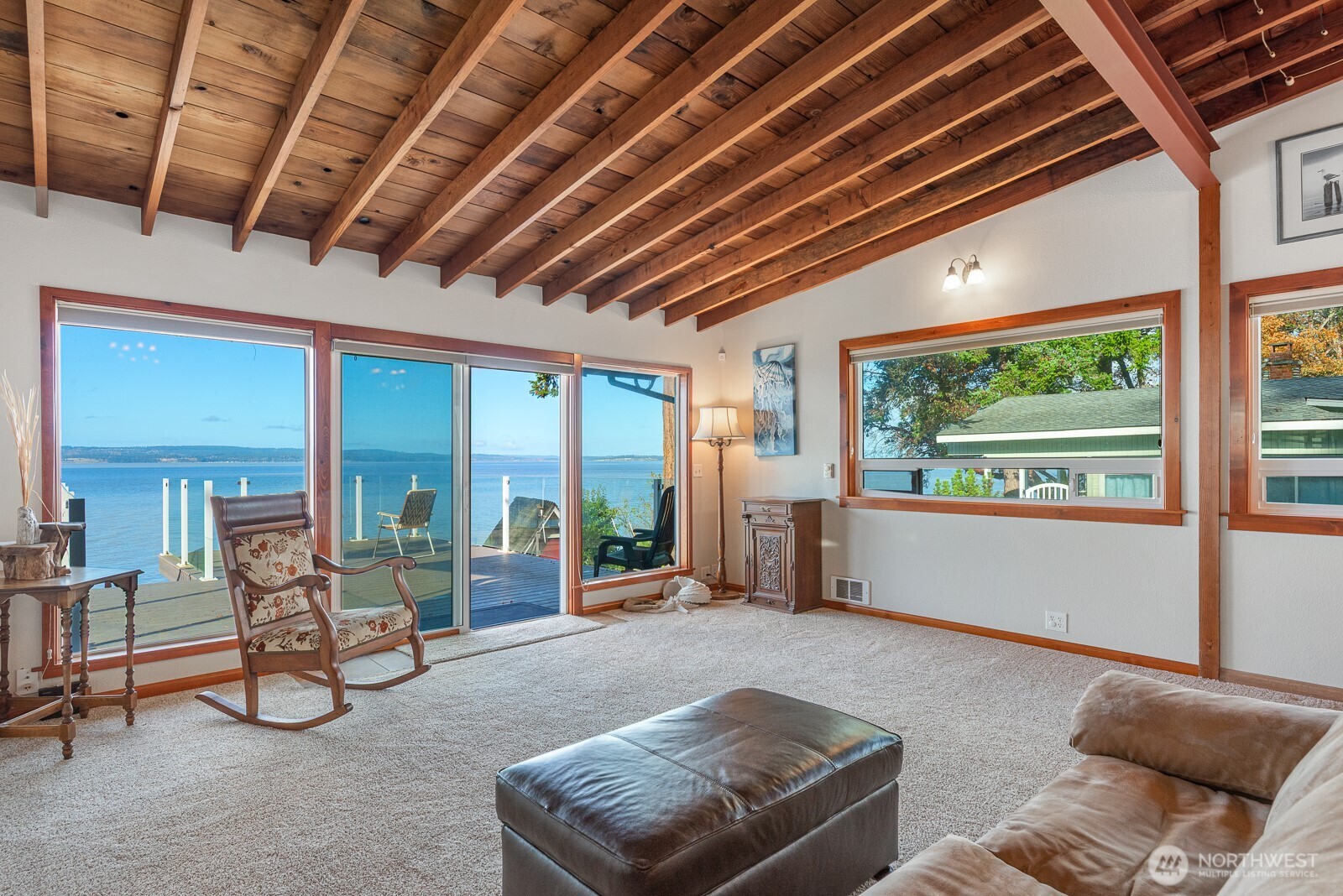 19422 Soundview Drive Northwest Stanwood, WA 98292 - Photo 17 of 33 a living room with furniture and a floor to ceiling window