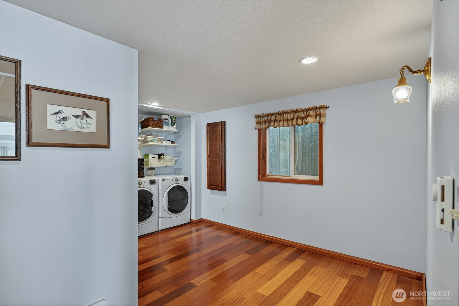 19422 Soundview Drive Northwest Stanwood, WA 98292 - Photo 18 of 33 a view of empty room with wooden floor