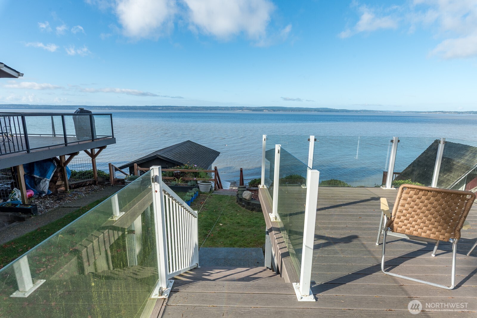 19422 Soundview Drive Northwest Stanwood, WA 98292 - Photo 26 of 33 a view of a chairs and table on the balcony