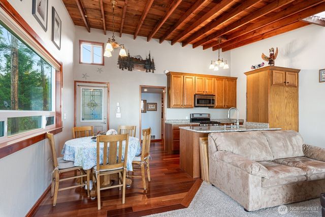 a kitchen with sink refrigerator and microwave