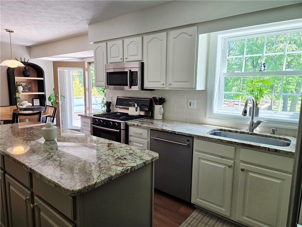 1081 Bright Stream Way Webster, NY 14580 - Photo 17 of 50 The kitchen has lots of natural light and counter space.