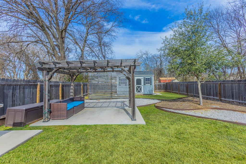 1202 Spring Street Waco, TX 76704 - Photo 15 of 16 a view of a backyard with a slide