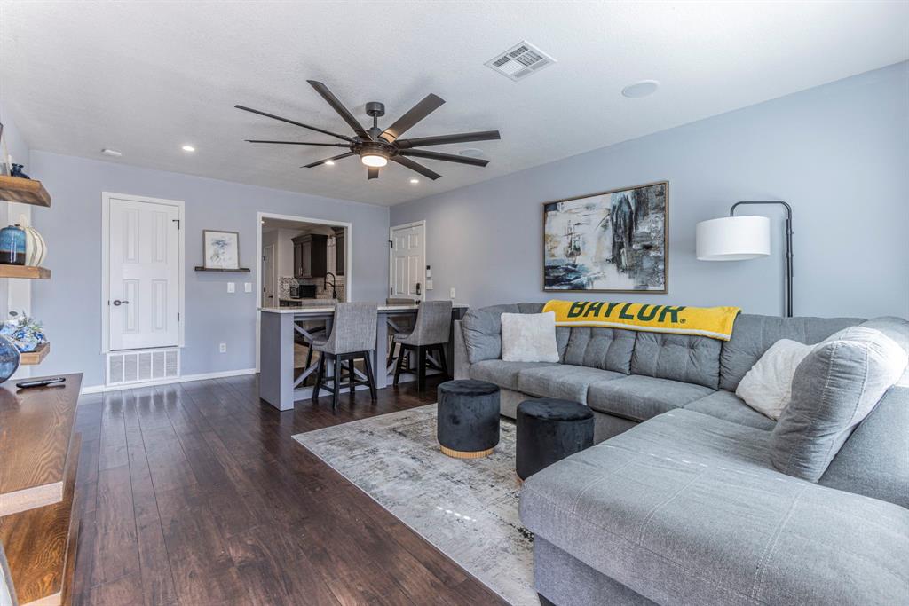 1202 Spring Street Waco, TX 76704 - Photo 3 of 16 a living room with furniture and wooden floor