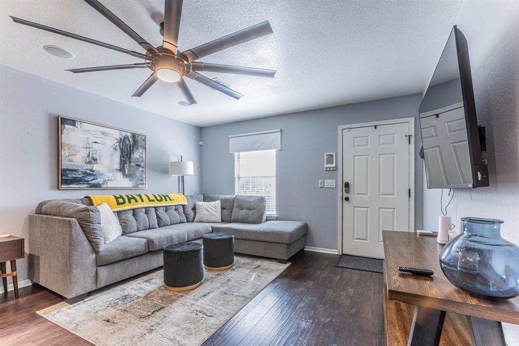 1202 Spring Street Waco, TX 76704 - Photo 4 of 16 a living room with furniture and wooden floor