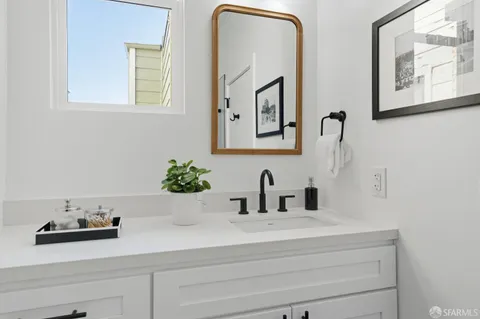 a bathroom with sink and mirror