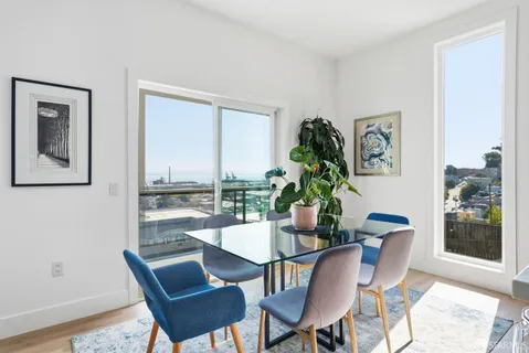 a view of living room with furniture and flowers