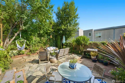 a potted plant sitting in front of a house