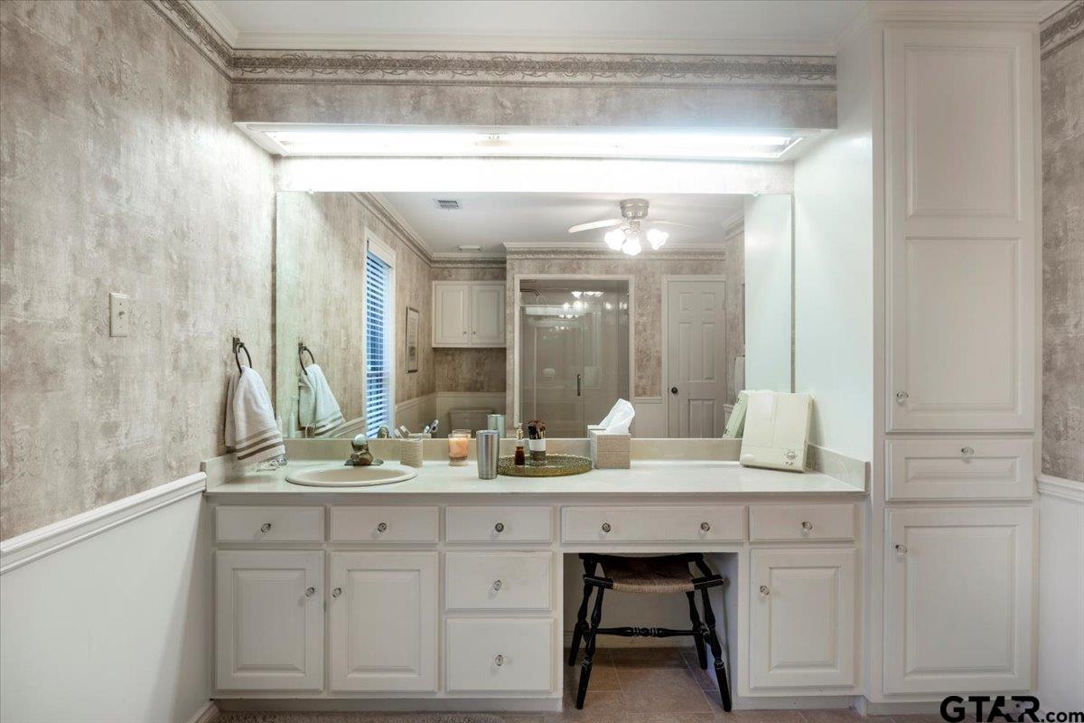 15246 7 League Road Tyler, TX 75703 - Photo 11 of 43 a bathroom with a sink and a mirror