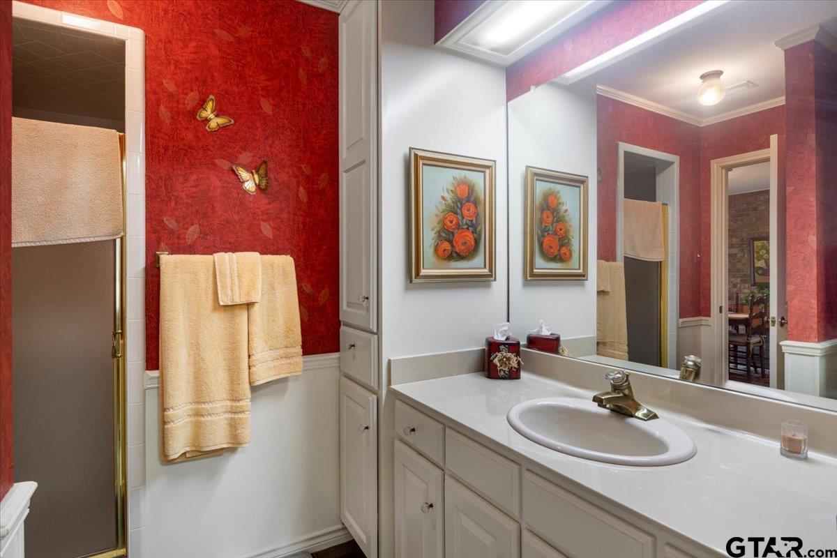 15246 7 League Road Tyler, TX 75703 - Photo 25 of 43 a bathroom with a sink and a mirror