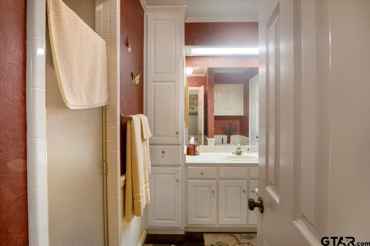15246 7 League Road Tyler, TX 75703 - Photo 27 of 43 a bathroom with a sink mirror and vanity