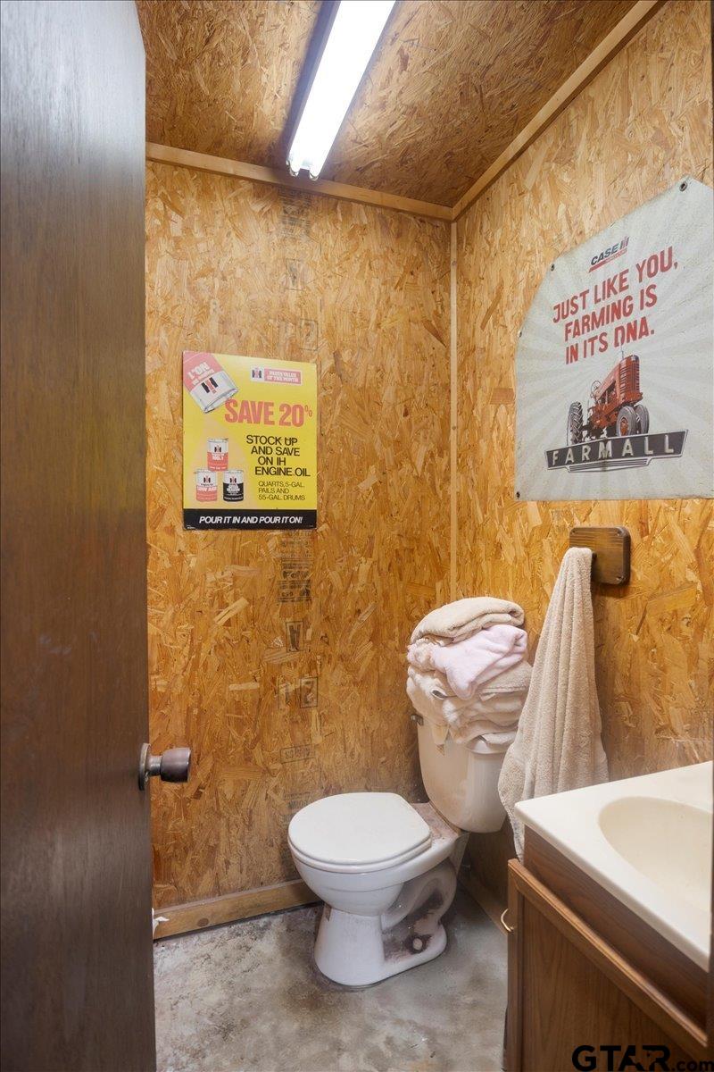 15246 7 League Road Tyler, TX 75703 - Photo 30 of 43 a white toilet sitting next to a bathroom sink