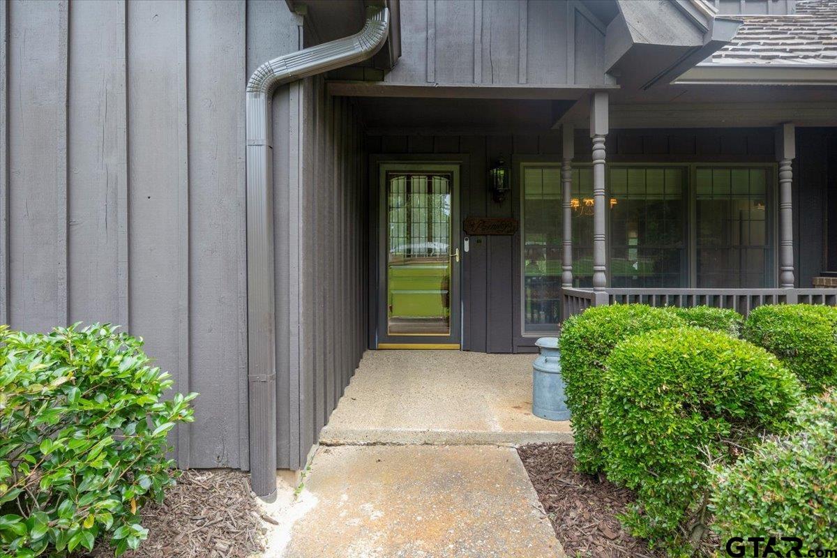 15246 7 League Road Tyler, TX 75703 - Photo 3 of 43 a view of entrance gate of the house and trees