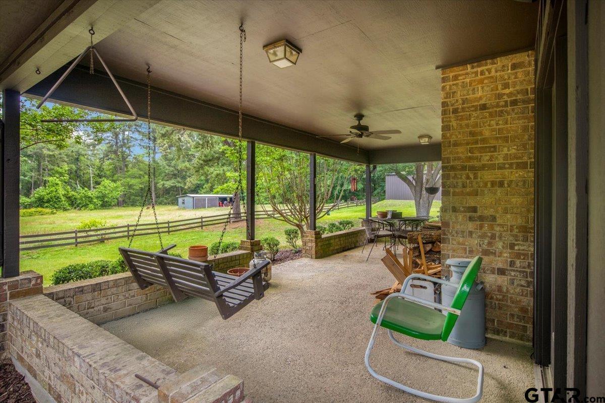15246 7 League Road Tyler, TX 75703 - Photo 31 of 43 a view of a porch with furniture and yard