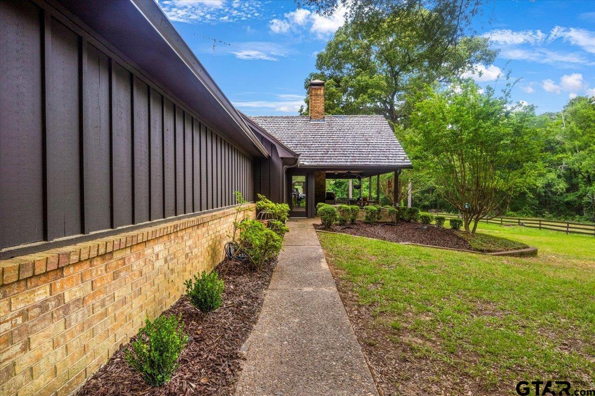 15246 7 League Road Tyler, TX 75703 - Photo 34 of 43 a view of a backyard with a garden