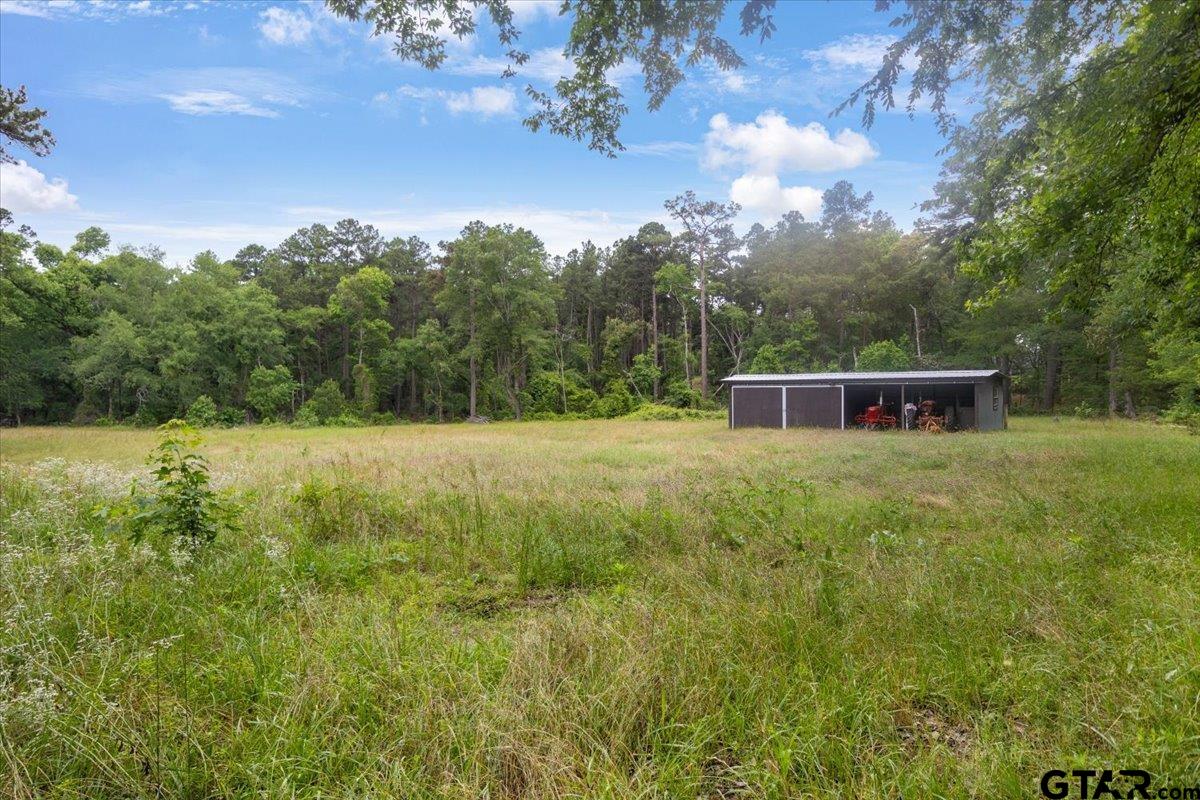 15246 7 League Road Tyler, TX 75703 - Photo 37 of 43 a view of a house with a yard