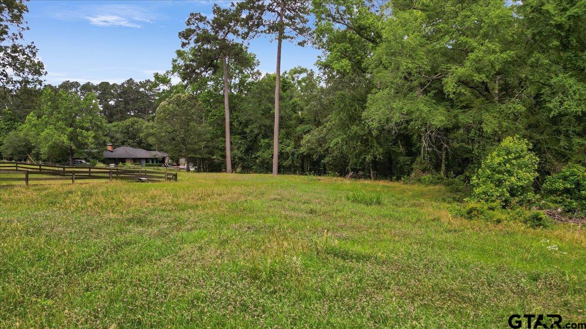 15246 7 League Road Tyler, TX 75703 - Photo 41 of 43 a view of outdoor space with deck and yard