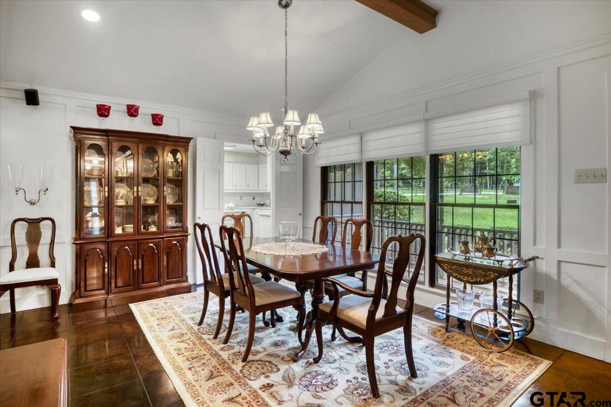 15246 7 League Road Tyler, TX 75703 - Photo 5 of 43 a dining room with furniture a rug and a chandelier