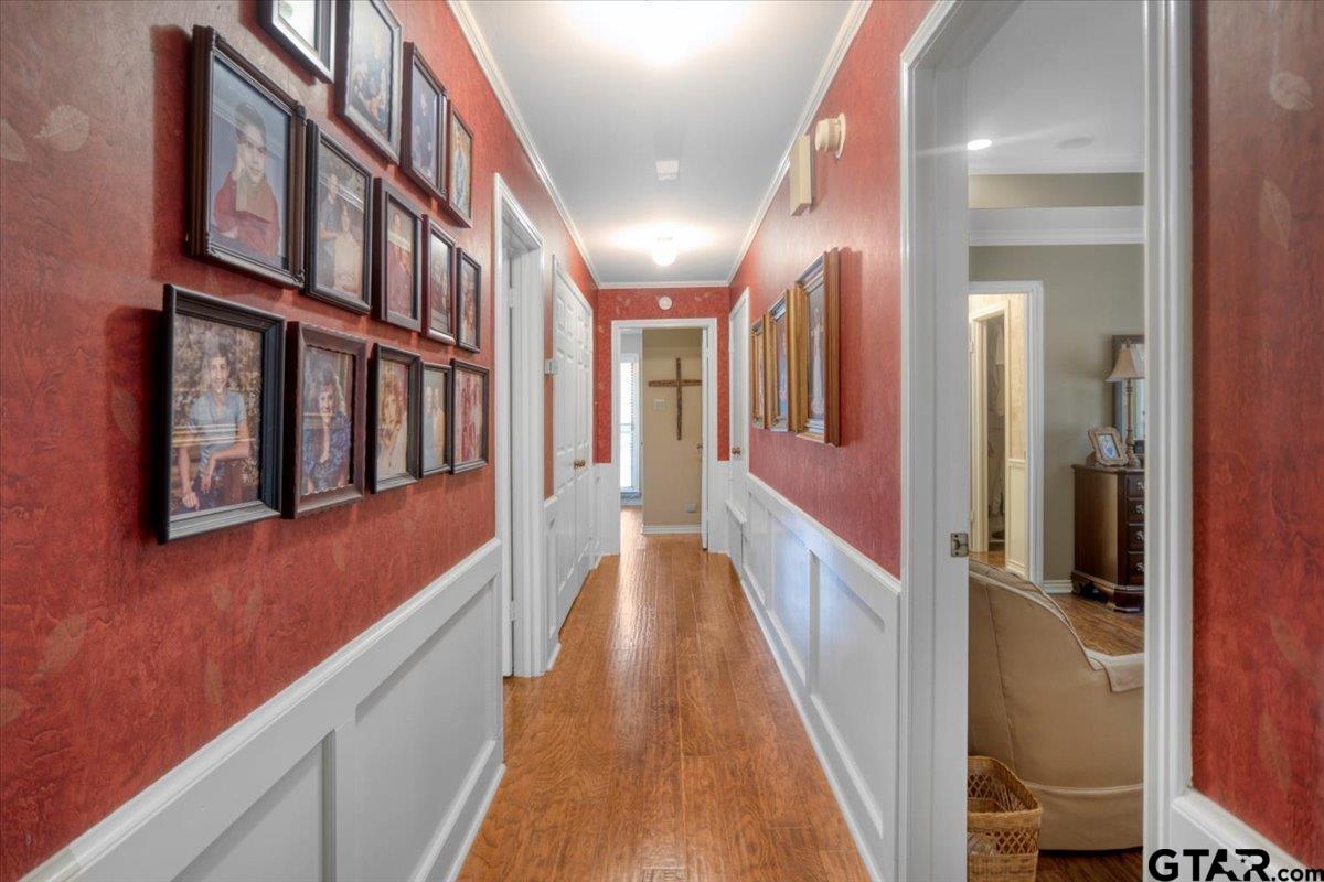 15246 7 League Road Tyler, TX 75703 - Photo 6 of 43 a view of a hallway with wooden floor and staircase