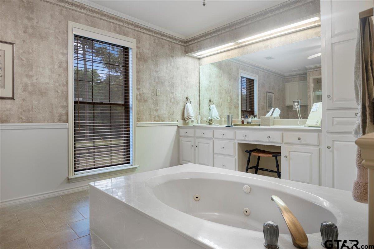 15246 7 League Road Tyler, TX 75703 - Photo 10 of 43 a spacious bathroom with a tub sink and mirror