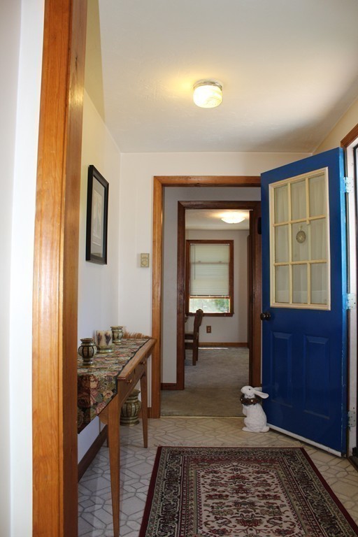 124 Sherbert Road Ashburnham, MA 01430 - Photo 11 of 27 a hallway with a table and chairs