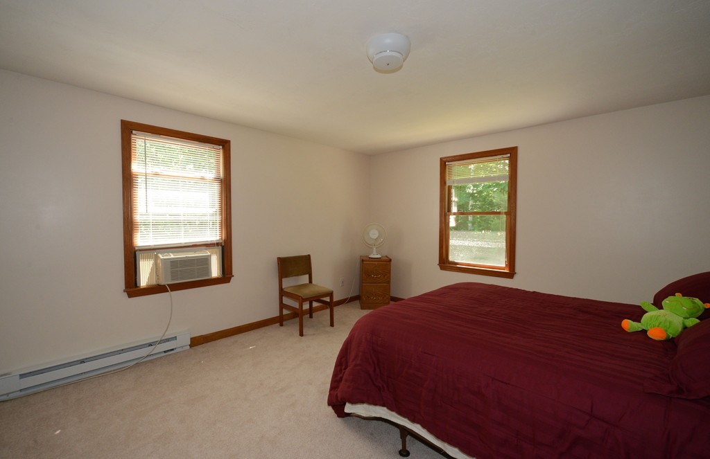 124 Sherbert Road Ashburnham, MA 01430 - Photo 12 of 27 a bedroom with a bed chair and a window