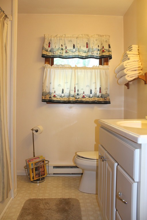 124 Sherbert Road Ashburnham, MA 01430 - Photo 17 of 27 a bathroom with a sink a toilet and mirror