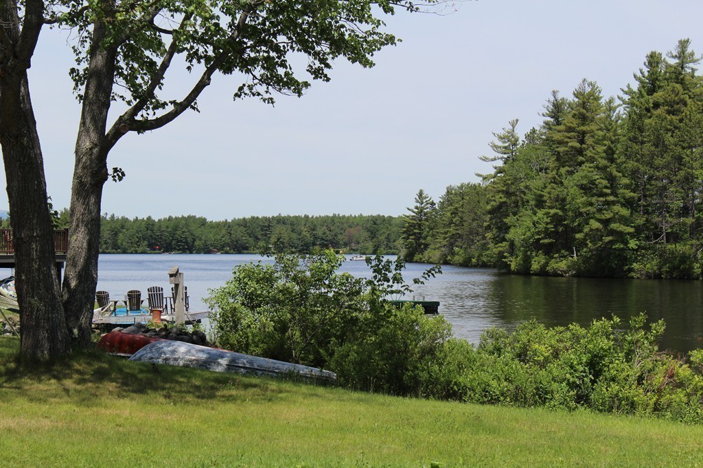 124 Sherbert Road Ashburnham, MA 01430 - Photo 24 of 27 a view of a lake with houses in the back