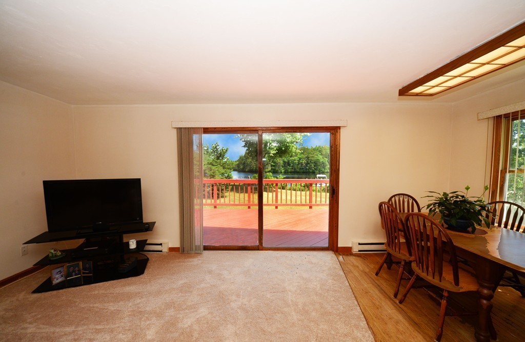 124 Sherbert Road Ashburnham, MA 01430 - Photo 5 of 27 a view of a livingroom with furniture and a flat screen tv